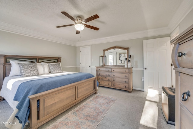 bedroom with ornamental molding, light carpet, ceiling fan, and a textured ceiling