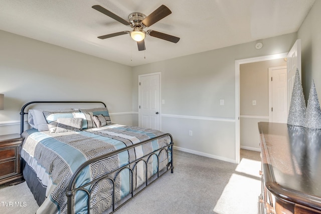 bedroom featuring ceiling fan and light colored carpet