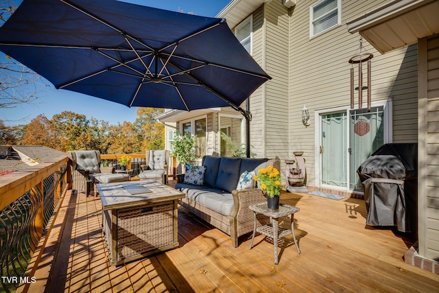 wooden deck with an outdoor hangout area