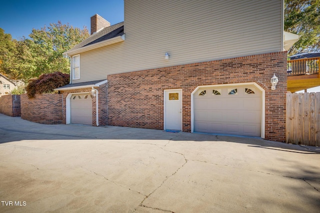 view of side of property with a garage