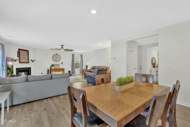 dining room featuring ceiling fan and light hardwood / wood-style floors