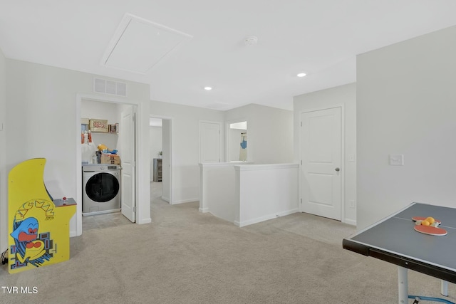 playroom with washer / dryer and light carpet