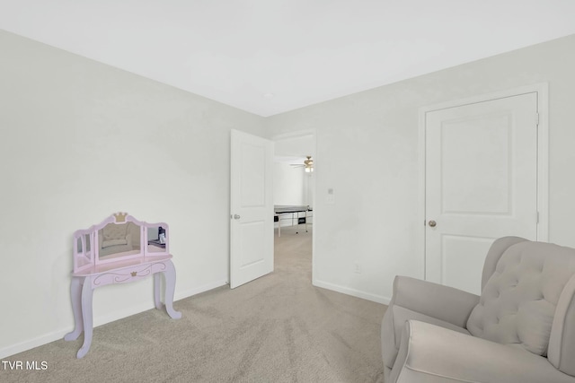 living area featuring light colored carpet