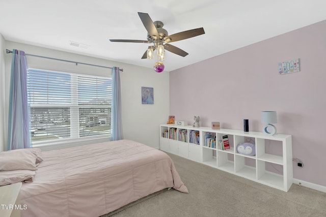 carpeted bedroom featuring ceiling fan