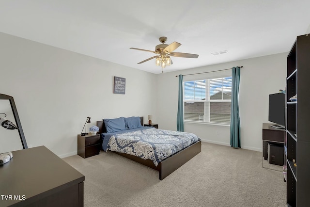 carpeted bedroom with ceiling fan