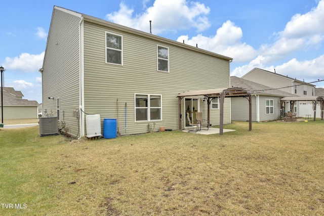 rear view of house with a pergola, a yard, a gazebo, and cooling unit