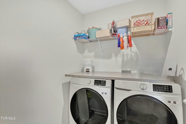 clothes washing area with independent washer and dryer