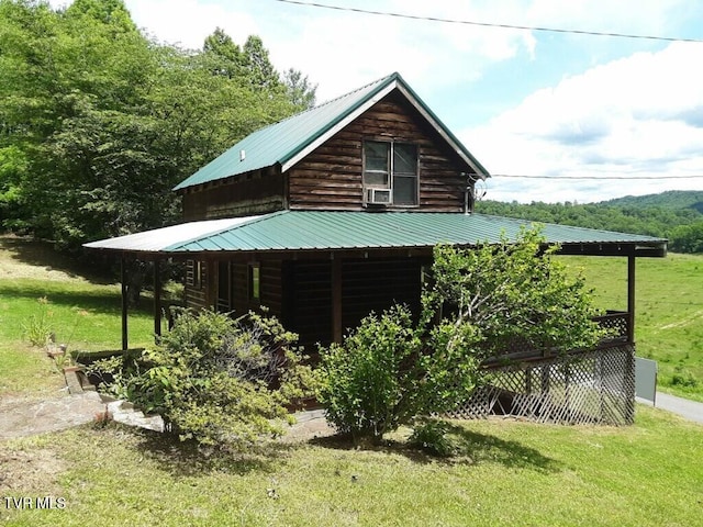 view of home's exterior with a yard