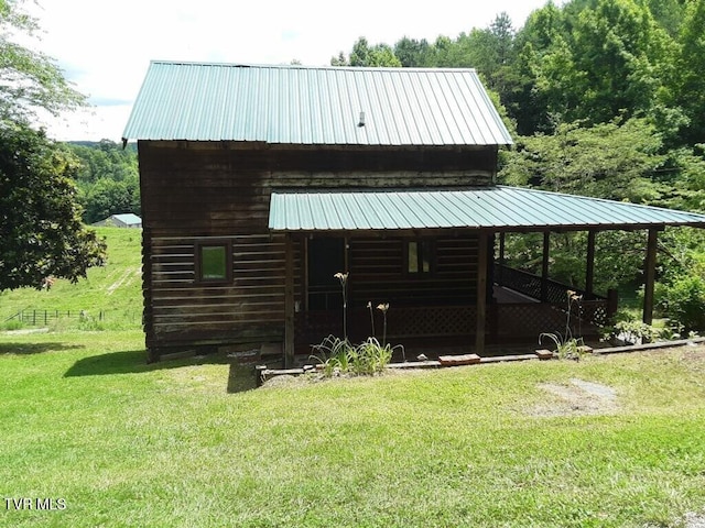 view of outdoor structure with a yard