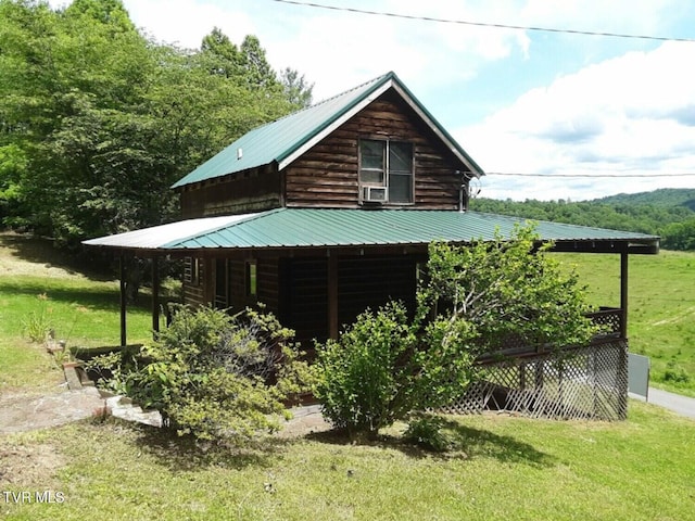 view of side of property with a yard