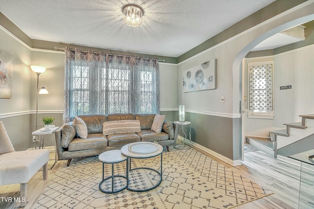 living room featuring hardwood / wood-style flooring and a textured ceiling