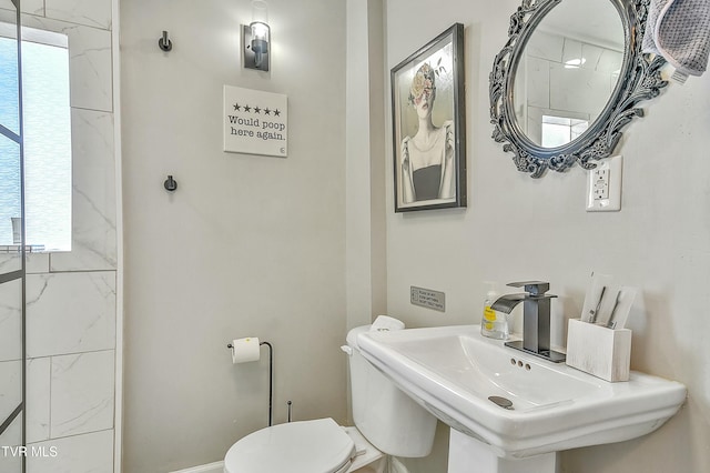 bathroom with sink and toilet