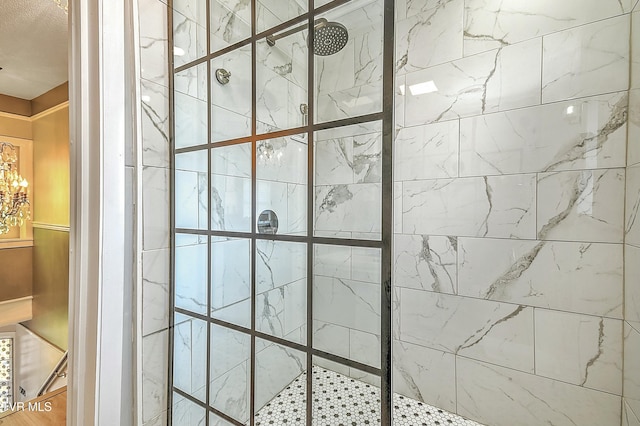 interior details with a tile shower