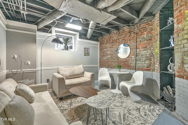 interior space featuring concrete floors and brick wall