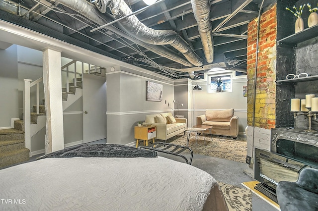 bedroom featuring concrete flooring