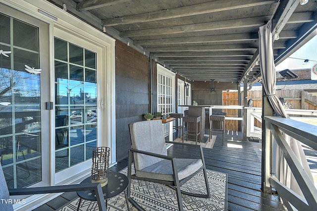 wooden deck featuring exterior bar