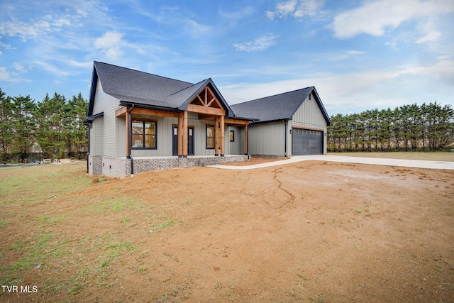 view of front of house with a porch and a garage