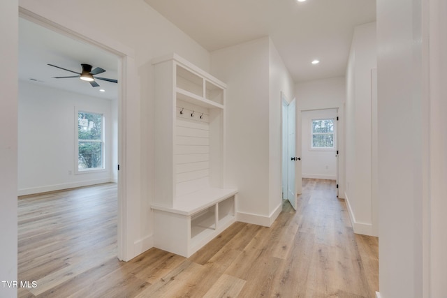 mudroom with light hardwood / wood-style floors and ceiling fan