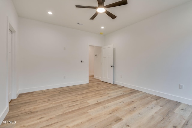 unfurnished room featuring ceiling fan and light hardwood / wood-style flooring