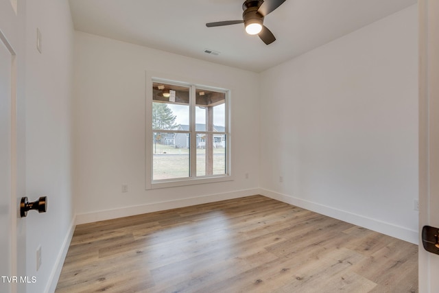 unfurnished room with ceiling fan and light wood-type flooring