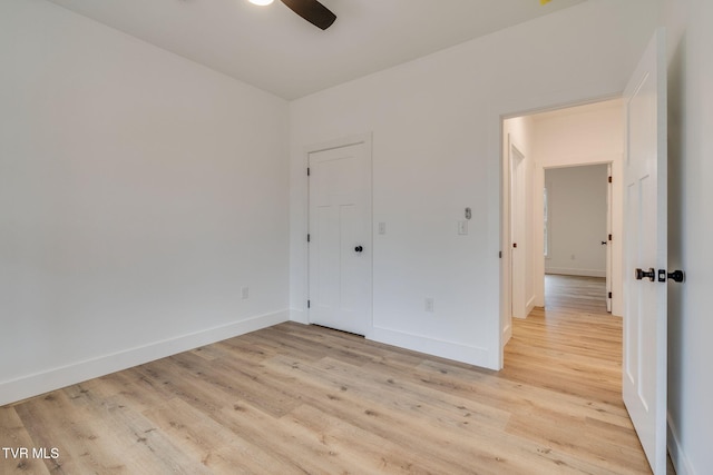 unfurnished bedroom with light hardwood / wood-style flooring and ceiling fan