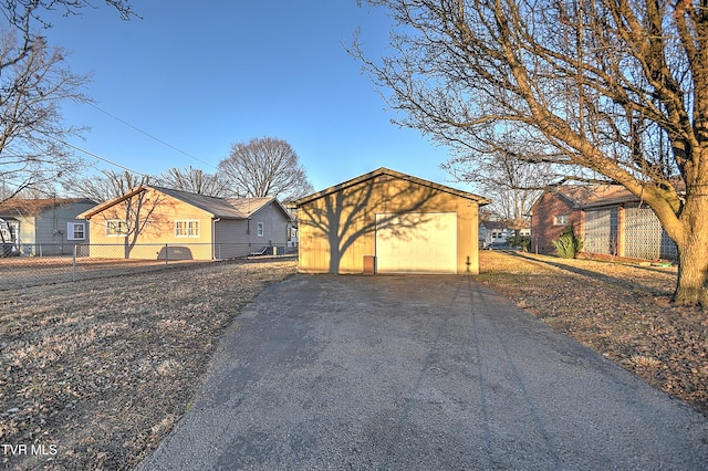 exterior space with an outbuilding and a garage