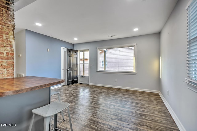 interior space with dark hardwood / wood-style flooring