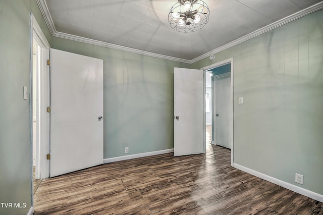 unfurnished bedroom with wood-type flooring and ornamental molding