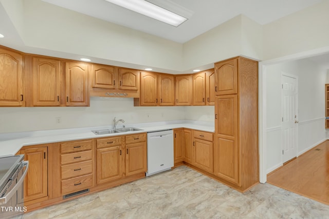 kitchen with dishwasher, sink, and stainless steel range with electric cooktop