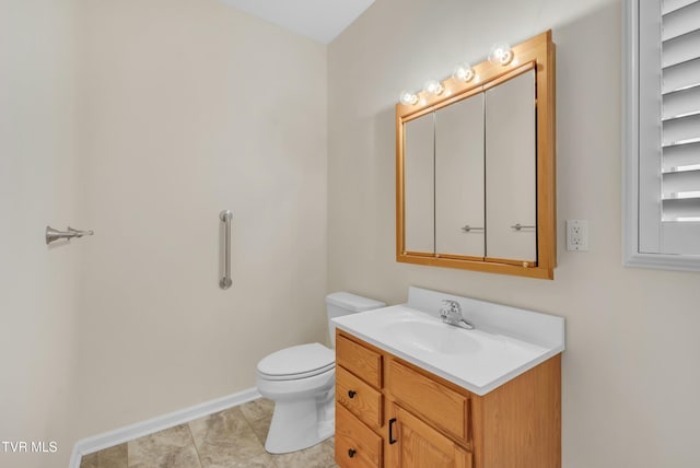 bathroom with tile patterned floors, vanity, and toilet