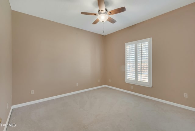 unfurnished room with ceiling fan and light colored carpet