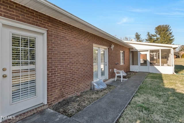 view of patio / terrace featuring a sunroom