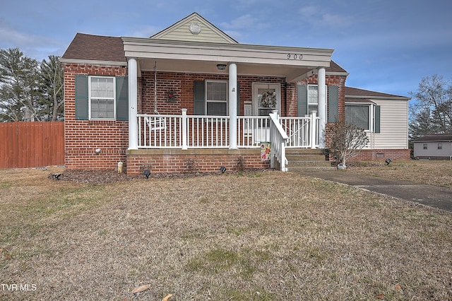 view of front of house featuring a porch and a front lawn