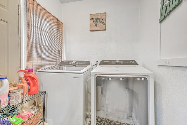 laundry room featuring separate washer and dryer