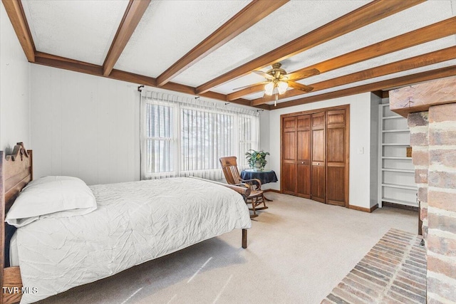 520 Heritage Ln, Jonesborough, TN 37659 - carpeted bedroom featuring baseboards, ceiling fan, beam ceiling, a textured ceiling, and a closet
