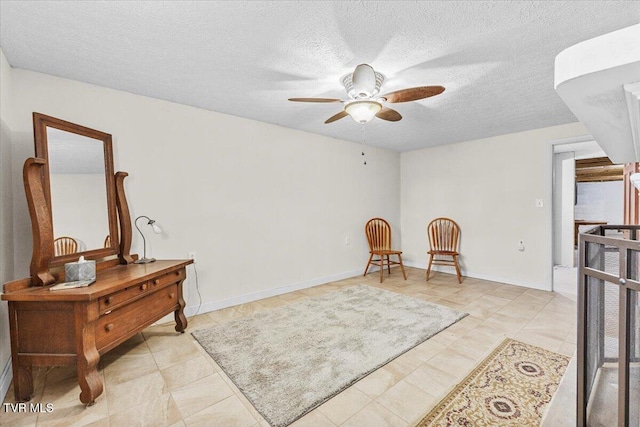 520 Heritage Ln, Jonesborough, TN 37659 - sitting room featuring ceiling fan, a textured ceiling, and baseboards