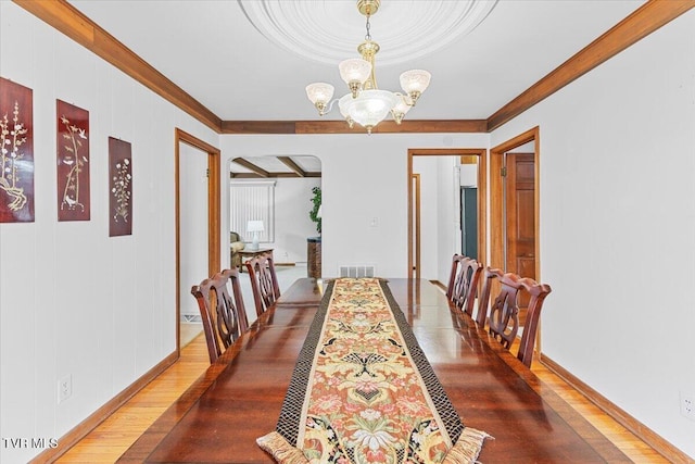 520 Heritage Ln, Jonesborough, TN 37659 - dining space featuring baseboards, visible vents, ornamental molding, wood finished floors, and a notable chandelier