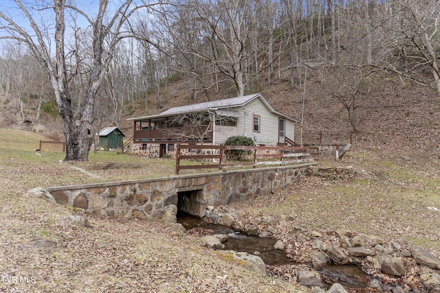 view of yard with a sunroom and a deck