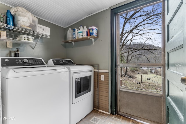 washroom with washing machine and clothes dryer