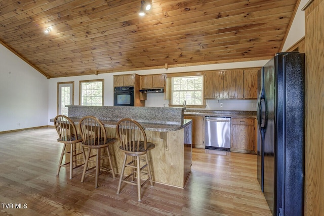 kitchen with light wood-style floors, wood ceiling, black appliances, and a healthy amount of sunlight