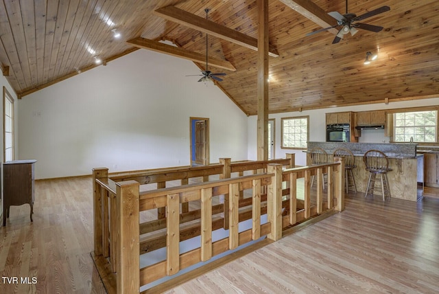bonus room featuring wood ceiling, ceiling fan, light wood-type flooring, and high vaulted ceiling