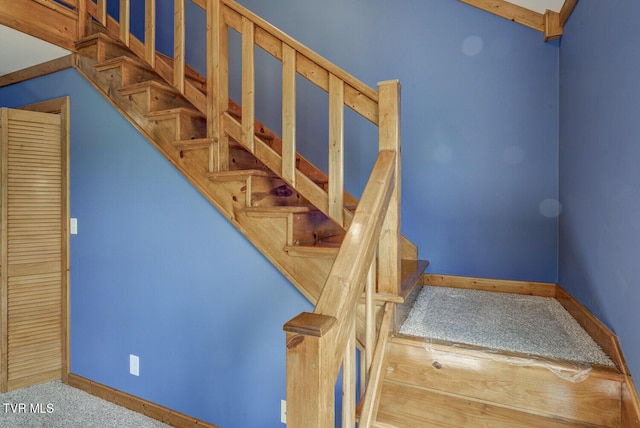stairs featuring baseboards