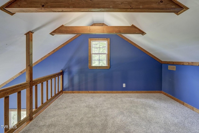 bonus room featuring carpet floors, baseboards, and vaulted ceiling