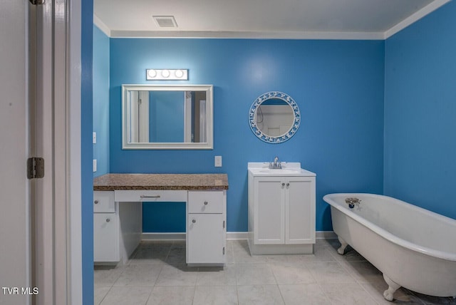 full bathroom with vanity, tile patterned floors, a freestanding tub, baseboards, and visible vents