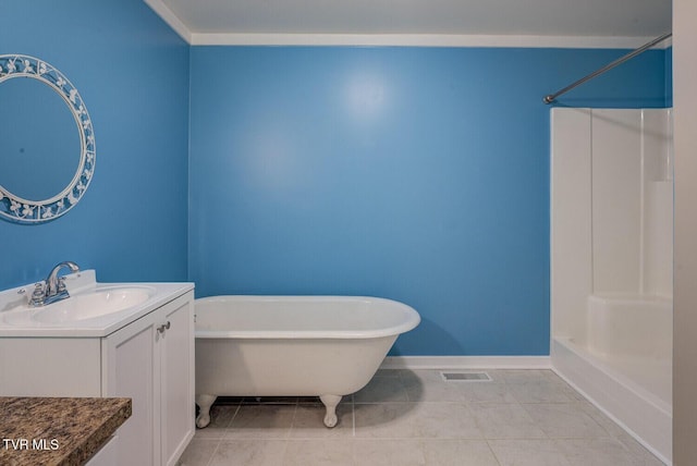 full bathroom with visible vents, vanity, baseboards, tile patterned floors, and a soaking tub