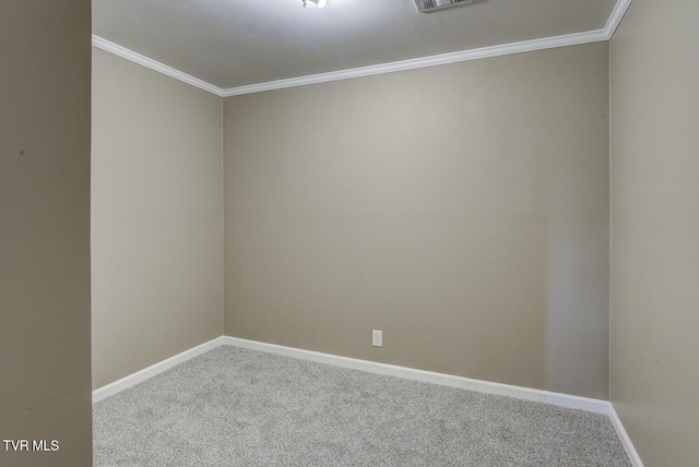 unfurnished room with carpet floors, baseboards, visible vents, and ornamental molding
