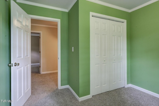 unfurnished bedroom with carpet floors, baseboards, and a closet