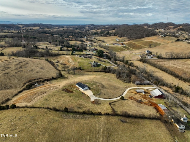 birds eye view of property featuring a rural view