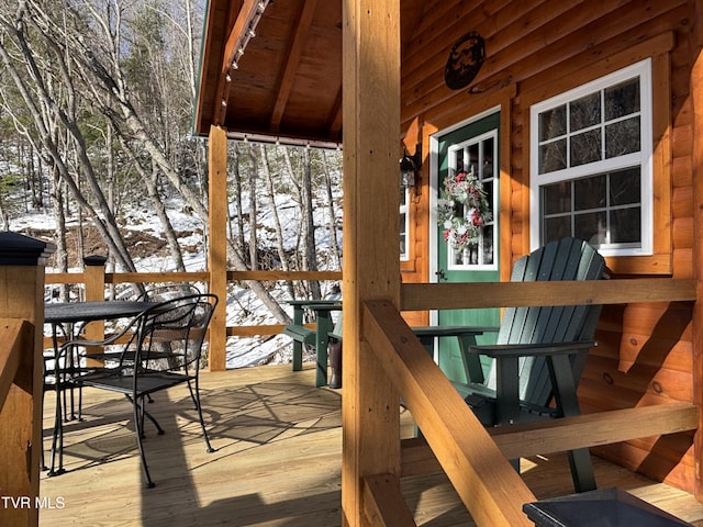 view of snow covered deck