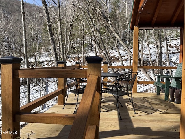 view of snow covered deck